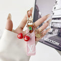 louis vuitton Cherry Charm Keychain with Monogram Leather Strap Luxury Designer Bag and Key Accessory